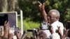 FILE - Uganda's former Prime Minister Amama Mbabazi, now a presidential candidate, speaks to the media at a gathering in Jinja town in eastern Uganda, Sept. 10, 2015. 