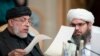 Participants of the conference on Afghanistan read papers in Moscow, Russia, Friday, Nov. 9, 2018. 