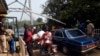FILE - Security guards check vehicles leaving Nigeria for Cameroon at a border checkpoint in Mfum, in Cross Rivers State, southeast Nigeria, Feb. 1, 2018.