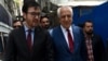 FILE - U.S. special representative for Afghan peace and reconciliation Zalmay Khalilzad (R) arrives for a forum talk at Tolo TV, in Kabul, Afghanistan, April 28, 2019.