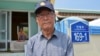  Kim Yoo-sung, 84, at the gate of his home that was severely damaged by the North Korean artillery attack. (Photo: VOA / Steve Herman) 