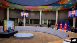 European Commission President Ursula von der Leyen, center, and European Council President Charles Michel hold a video conference with Turkey's President Recep Tayyip Erdogan, at the European Council building in Brussels, Belgium, March 19, 2021. 