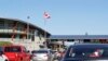 FILE - Traffic enters Canada from the United States at the Peace Arch Border Crossing in Blaine, Washington, Oct. 9, 2019. More than 60 Iranians and Iranian-Americans reportedly were detained and questioned at the border crossing over the weekend.