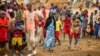 FILE - Refugees are seen gathered at Minawao Refugee Camp in northern Cameroon, April 18, 2016. 