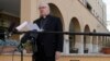 Brisbane's Archbishop Mark Coleridge reads a statement to the media on the conviction of Australian Cardinal George Pell for molesting two choir boys in the 1970s, in Rome, Feb. 26, 2019.