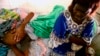 Jonas Lukano, 60, who is has diabetes, is watched over by his sister at the state general hospital in Congo's capital of Kinshasa. (file photo)