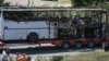 Bus destroyed in a deadly suicide attack on Israeli vacationers is transported out of Burgas airport, Bulgaria, July 19, 2012.