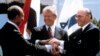 FILE - In this March 26, 1979, file photo, Egyptian President Anwar Sadat, left, U.S. President Jimmy Carter, center, and Israeli Prime Minister Menachem Begin clasp hands on the North lawn of the White House as they completed signing of the peace treaty 