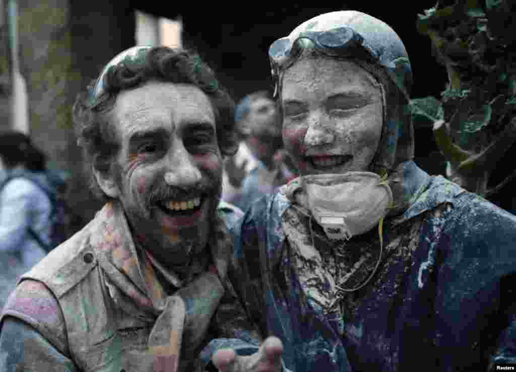 Revelers participate in a flour fight during the &quot;O Entroido&quot; festival in Laza village, Spain, Feb. 8, 2016.