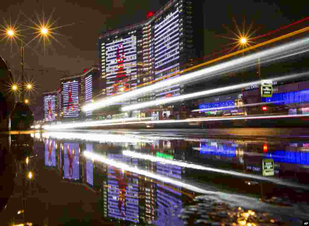 The red ribbon, the international symbol for AIDS awareness highlighted on the skyscrapers on Arbat street during a campaign to mark World AIDS Day in Moscow, Russia.