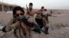 FILE - Shi'ite volunteers, who have joined the Iraqi army to fight against Islamic State militants, take part in a military-style training in Basra, Iraq. 