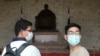 People wear face masks to protect against the spread of the new coronavirus at Chiang Kai-shek Memorial Hall in Taipei, Taiwan, Thursday, Feb. 27, 2020.