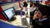 FILE: Employees of Snapdeal.com, an Indian online discount shopping website, work inside their company office in New Delhi, Mar. 1, 2012. 