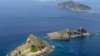 FILE - A group of disputed islands, Uotsuri island (t), Minamikojima (b) and Kitakojima, known as Senkaku in Japan and Diaoyu in China is seen in the East China Sea, in this photo taken by Kyodo September 2012.