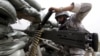 A Saudi soldier loads ammunition at their position at Saudi Arabia's border with Yemen, April 6, 2015. 
