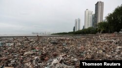 Plastic waste piles and debris are seen near the beach in Panama City, July 19, 2019.