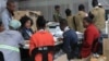 Electoral Commision officials at a tally center in Blantyre verifying votes from districts. (Lameck Masina/VOA) 