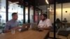 Brand strategist Phil Pallen (left) travels the world and works in the co-working spaces of a company called WeWork, seen here at a location in downtown Los Angeles. (M. O'Sullivan / VOA)