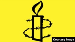 На фото: Частина логотипу організації  Amnesty International