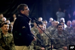 Defense Secretary Ashton Carter speaks with U.S. military personnel at Kandahar Airfield in Afghanistan, Feb. 22, 2015.