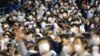 Baseball fans cheer their teams during a game between Kiwoom Heroes and Doosan Bears in Seoul, South Korea, Nov. 1, 2021. 
