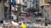 Damaged buildings and rubble are seen in old Homs city, Syria May 8, 2014.