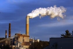 FILE - A plume of smoke billows from the coal-fired Merrimack Station in Bow, New Hampshire, Jan. 20, 2015.