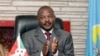 FILE - Burundi President Pierre Nkurunziza claps after signing the new constitution at the Presidential Palace in Gitega Province, June 7, 2018.