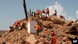 FILE - Nepalese soldiers clear the debris after an earthquake at the Kaalmochan temple in Kathmandu, Nepal, May 2, 2015. 