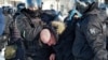 Police detain a man during a protest against the jailing of opposition leader Alexei Navalny in Khabarovsk, 6,100 kilometers (3,800 miles) east of Moscow, Russia, Saturday, Jan. 23, 2021. Authorities in Russia have taken measures to curb protests…