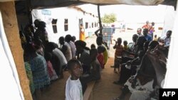FILE - Refugees from South Sudan wait to receive treatment at the Bidibidi health center in the Northern District of Yumbe, Uganda, April 14, 2017. 