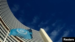 FILE - The flag of the International Atomic Energy Agency flies in front of its headquarters in Vienna, Austria.