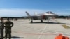 FILE - First parts of a Russian S-400 missile defense system are unloaded from a Russian plane near Ankara, Turkey, July 12, 2019. 