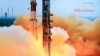 This television frame grab taken from Indian television channel NDTV, broadcasting live footage from state television Doordarshan, shows the PSLV-C25 launch vehicle carrying the Mars Orbiter probe as its payload lifting off from the launch pad in Sriharik