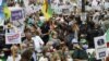 People attend a demonstration in Paris on July 5, 2020 in support of Algeria's Hirak key protest movement as Algeria celebrates today the anniversary of its 1962 independence from France.