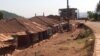 Clothes hang on a clothes line in front of a row of largely abandoned homes, in Kumbo, Cameroon, Jan. 3, 2019. (M. E. Kindzeka/VOA)