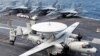 An E-2C Hawkeye lands on the deck of U.S. aircraft carrier USS George Washington during joint military drills between the U.S. and South Korea in the Yellow Sea, southwest of Seoul, June 24, 2012.
