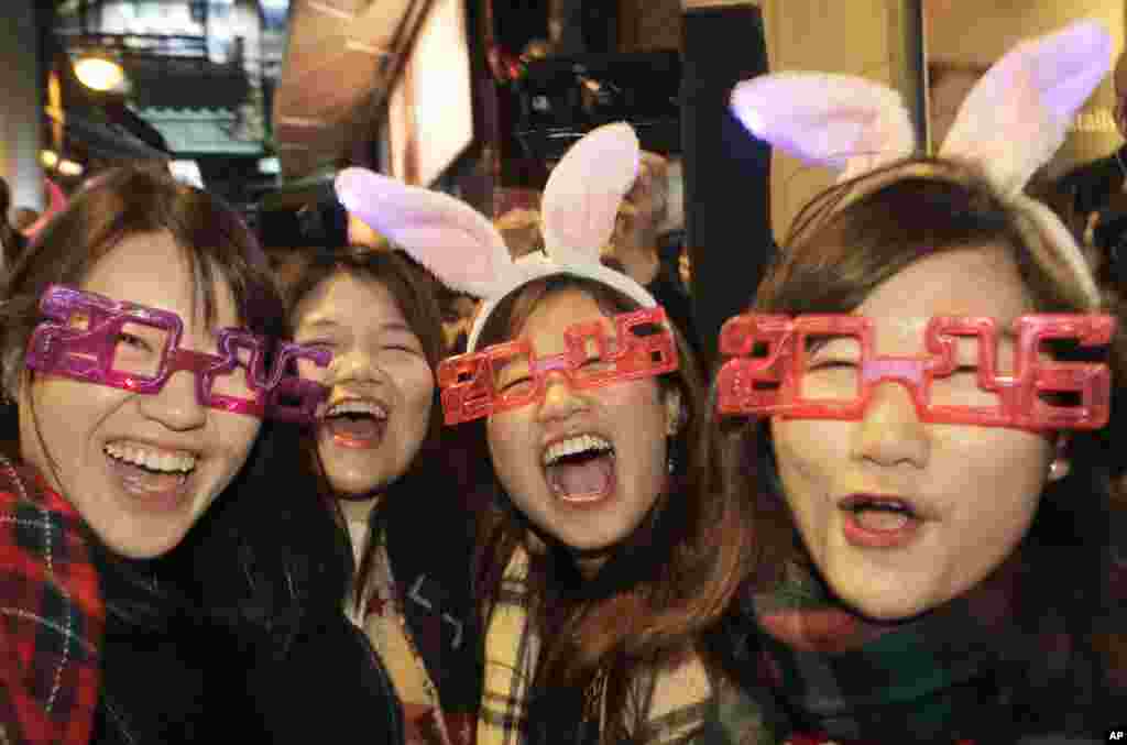 Revelers smile during the New Year&#39;s Eve celebrations in Hong Kong&#39;s Lan Kwai Fong.