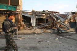 An Afghan security personnel arrive at the site of suicide attack in Jalalabad east of Kabul, Oct. 25, 2019.
