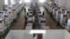 Health workers test for COVID-19 at a testing center at the Palacio de Manila in the Philippines during an enhanced community quarantine to prevent the spread of the new coronavirus on May 11, 2020. 