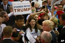 FILE - Republican presidential candidate Donald Trump greets supporters during a rally, in San Jose, Calif.