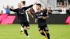 Wayne Rooney (kiri) merayakan gol yang dicetak oleh rekan setimnya, Luciano Acosta (10) saat melawan tim Vancouver Whitecaps di stadion Audi Field di Washington DC, Sabtu (14/7).
