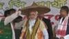 India&#39;s main opposition Bharatiya Janata Party&#39;s prime ministerial candidate Narendra Modi is presented with a traditional hat during an election campaign rally at Gogamukh, in the northeastern state of Assam, India, March 31, 2014.