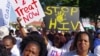 FILE - Activists march in Durban, South Africa, July 18, 2016, at the start of the 21st World Aids Conference. A new clinical trial is underway in South Africa on an experimental vaccine that could safely prevent HIV, the virus that causes AIDS.