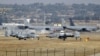 FILE - U.S. Air Force A-10 Thunderbolt II fighter jets (foreground) are pictured at Incirlik Air Base, near Adana, Turkey, Dec. 11, 2015.
