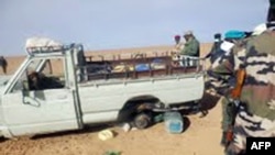 A picture taken with a mobile phone Oct. 30, 2013 and received on Nov. 2, 2013 shows one of the trucks that was carrying some of 92 migrants who died of thirst in the harsh Niger desert, about a dozen kilometers from the Algerian border. 