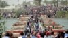 Displaced Sunni people, who fled the violence in the city of Ramadi, arrive at the outskirts of Baghdad, Iraq, April 17, 2015.