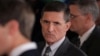 FILE - Then-White House national security adviser Michael Flynn, center, arrives at the White House in Washington, Feb. 13, 2017.