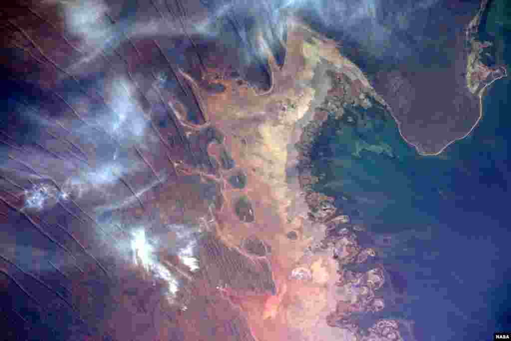 During an International Space Station flyover of Australia, NASA astronaut Jeff Williams captured a colorful image of the coast and shared it with his social media followers. &quot;The unique terrain of the northwestern Australian coast,&quot; he wrote.