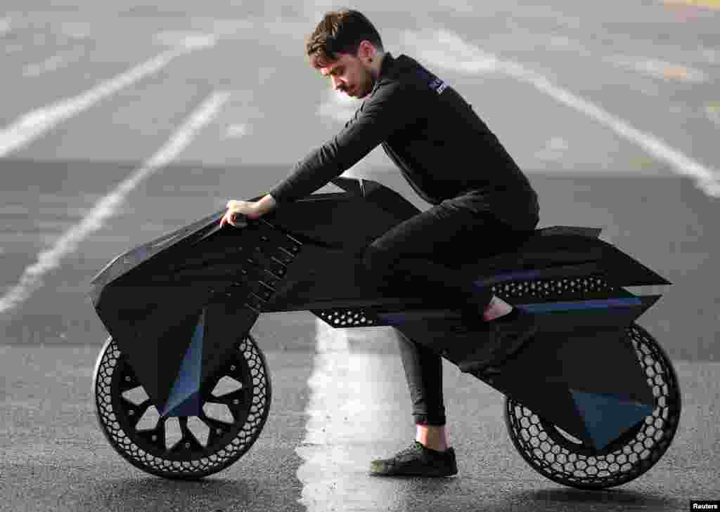 Designer Marco Mattia Cristofori of the German 3D printer manufacturer BigRep, stands with his nearly completed 3D printed e-motorcycle NERA, at the airfield Tempelhof in Berlin.